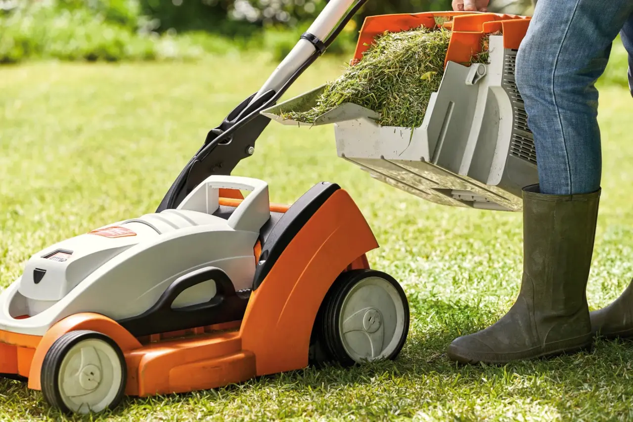A STIHL lawn mower on a perfectly cut green lawn